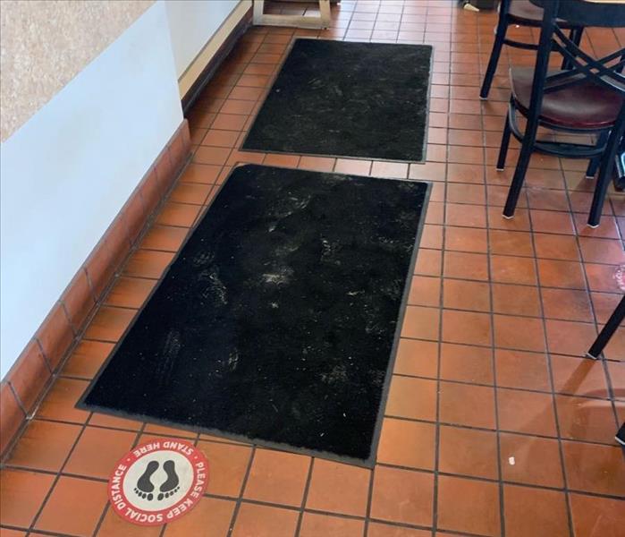 A restaurant floor is dirty.
