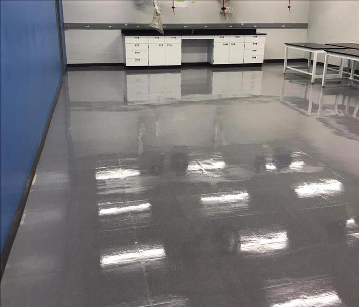 image of same commercial tiled floor after its been cleaned and buffed by SERVPRO