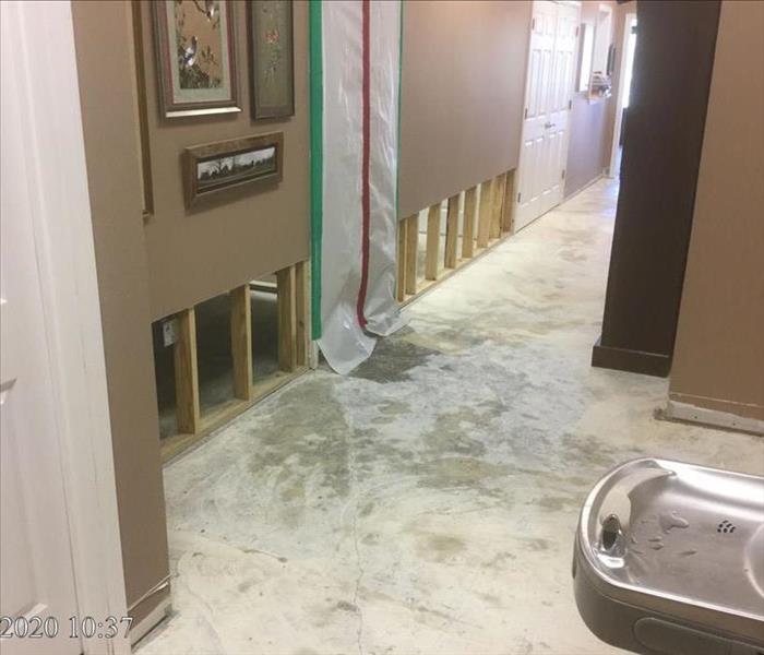 image of same commercial hallway with floor dried and 3 ft. flood cuts made and present