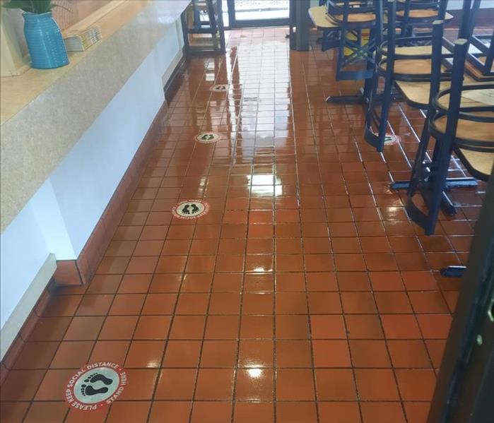 The restaurant floor is cleaned and shined.
