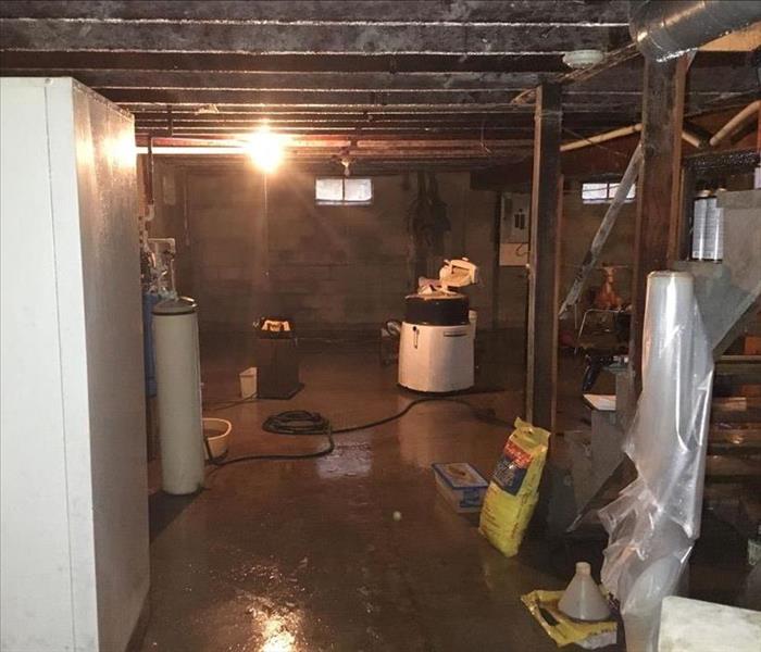 A basement has water from a storm.