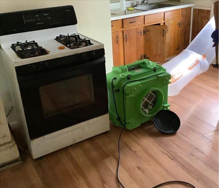 SERVPRO equipment sits in a kitchen.