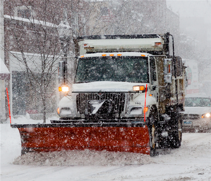 snow truck plowing snow