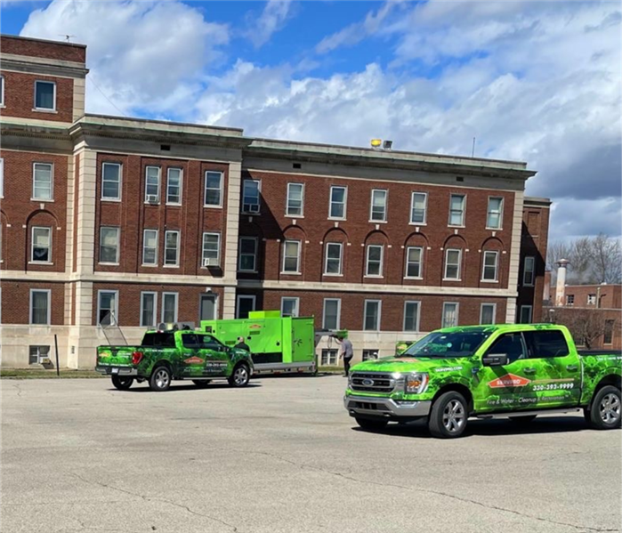 servpro vehicles in front of building