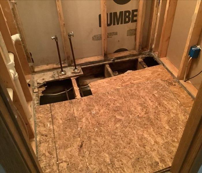 The toilet, wall, and flooring has been removed.